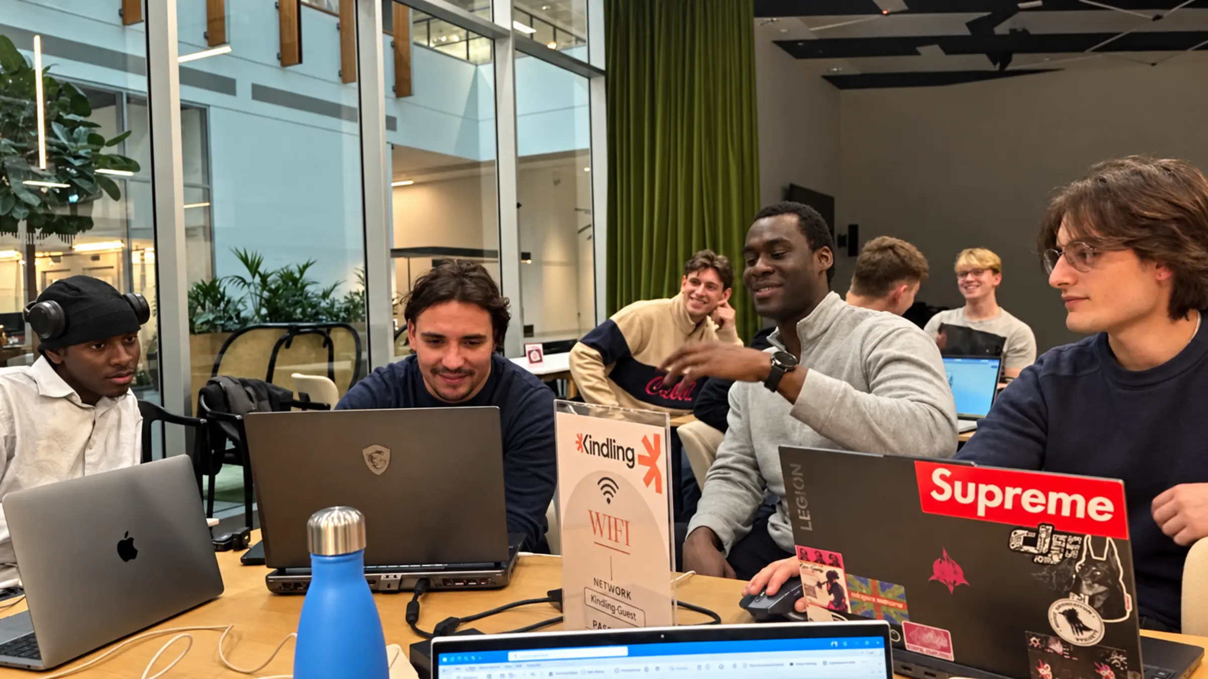 Tiwa and StudentVenture cohort members gathered around laptops at the Vicarious playtest.
